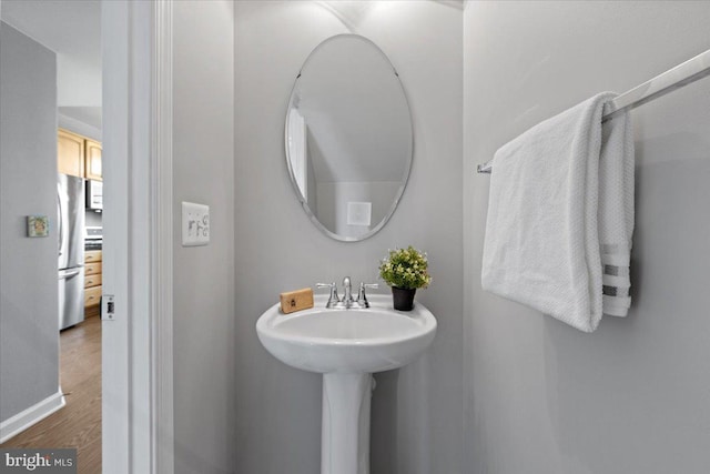 20973 Killawog Ter, Ashburn, VA 20147 - bathroom with wood finished floors and baseboards