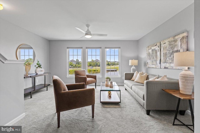 20973 Killawog Ter, Ashburn, VA 20147 - carpeted living area with healthy amount of natural light, a ceiling fan, and baseboards