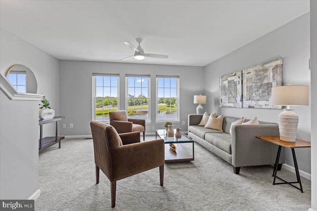 20973 Killawog Ter, Ashburn, VA 20147 - carpeted living room with ceiling fan and baseboards