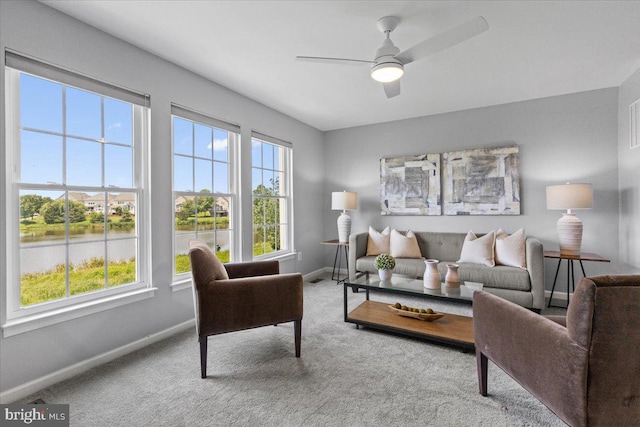 20973 Killawog Ter, Ashburn, VA 20147 - carpeted living area featuring plenty of natural light, baseboards, and ceiling fan