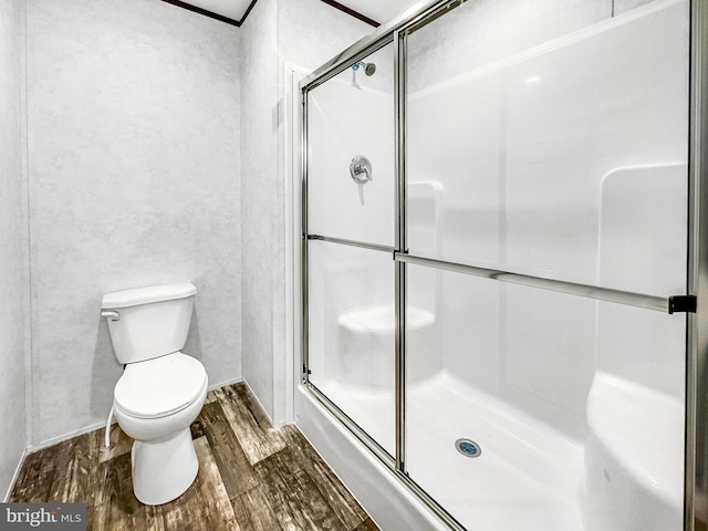 309 Fern Rd, Millville, NJ 08332 - bathroom with wood finished floors, a stall shower, and toilet