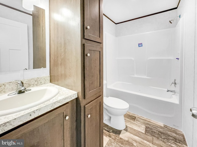 309 Fern Rd, Millville, NJ 08332 - bathroom featuring toilet, vanity, wood finished floors, shower / tub combination, and ornamental molding
