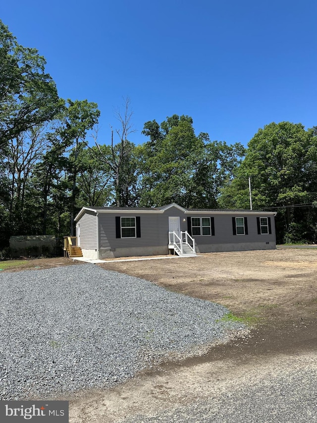 309 Fern Rd, Millville, NJ 08332 - manufactured / mobile home featuring entry steps and view of scattered trees