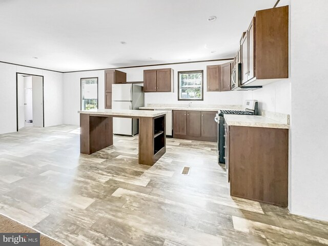 309 Fern Rd, Millville, NJ 08332 - kitchen featuring stainless steel appliances, a center island, light countertops, and open shelves