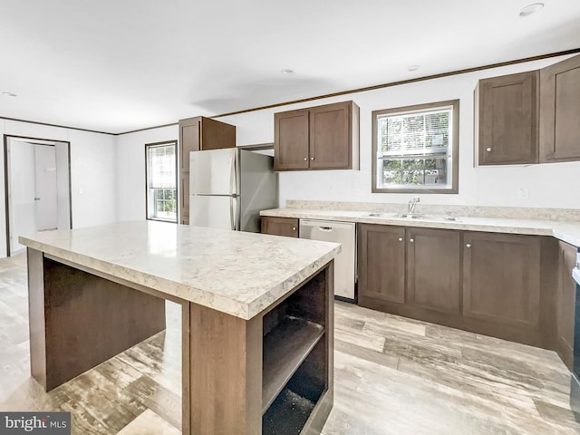 309 Fern Rd, Millville, NJ 08332 - kitchen featuring dishwasher, freestanding refrigerator, a sink, a kitchen island, and open shelves