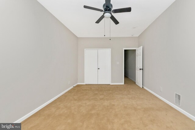 2828 Woodbrook Ave, Baltimore, MD 21217 - unfurnished bedroom featuring a closet, ceiling fan, light colored carpet, baseboards, and visible vents