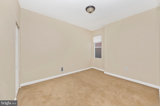 2828 Woodbrook Ave, Baltimore, MD 21217 - unfurnished room with baseboards, visible vents, and light colored carpet