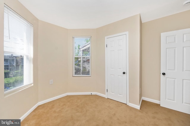 2828 Woodbrook Ave, Baltimore, MD 21217 - unfurnished bedroom featuring baseboards and light colored carpet