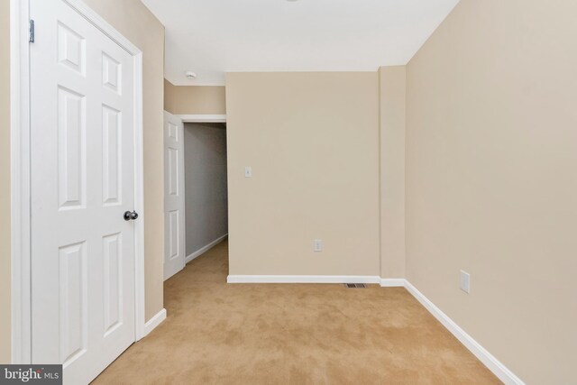 2828 Woodbrook Ave, Baltimore, MD 21217 - unfurnished bedroom with visible vents, baseboards, and light colored carpet