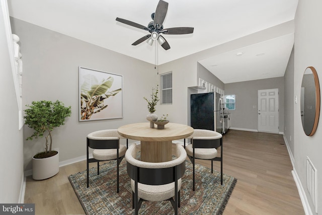 2828 Woodbrook Ave, Baltimore, MD 21217 - dining area featuring light wood-type flooring, a ceiling fan, baseboards, and visible vents
