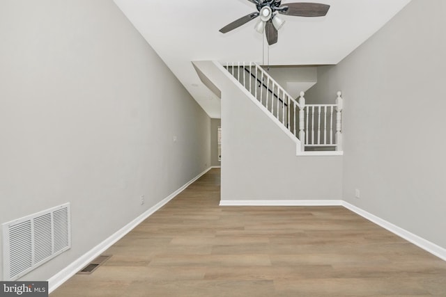 2828 Woodbrook Ave, Baltimore, MD 21217 - unfurnished living room featuring stairway, baseboards, a ceiling fan, and visible vents