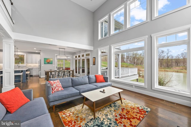 59 N Ridgemont Way, Shepherdstown, WV 25443 - living room featuring a high ceiling, plenty of natural light, and dark wood-type flooring