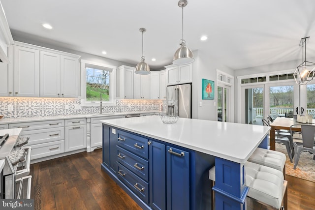 59 N Ridgemont Way, Shepherdstown, WV 25443 - kitchen featuring high quality appliances, a sink, white cabinetry, blue cabinets, and light countertops