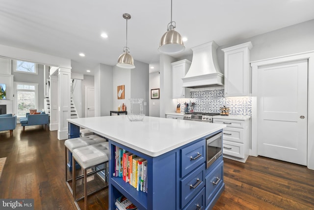 59 N Ridgemont Way, Shepherdstown, WV 25443 - kitchen featuring custom exhaust hood, blue cabinets, white cabinetry, light countertops, and appliances with stainless steel finishes