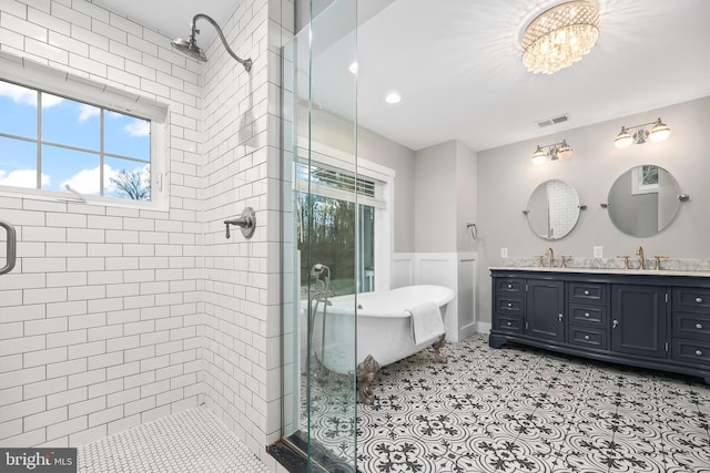 59 N Ridgemont Way, Shepherdstown, WV 25443 - full bath with plenty of natural light, a stall shower, double vanity, a freestanding bath, and a wainscoted wall