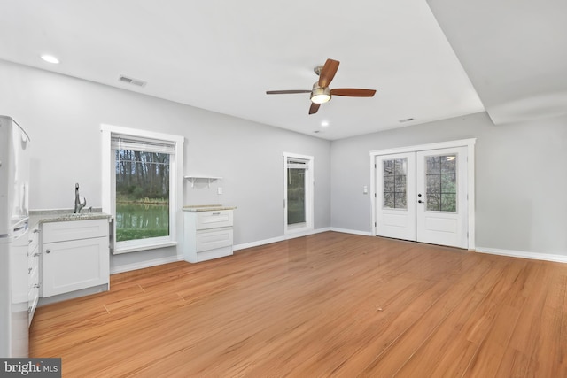 59 N Ridgemont Way, Shepherdstown, WV 25443 - unfurnished living room with a ceiling fan, french doors, light wood-style flooring, baseboards, and recessed lighting