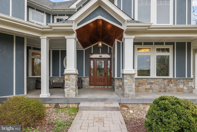 59 N Ridgemont Way, Shepherdstown, WV 25443 - property entrance featuring covered porch, stone siding, and stucco siding