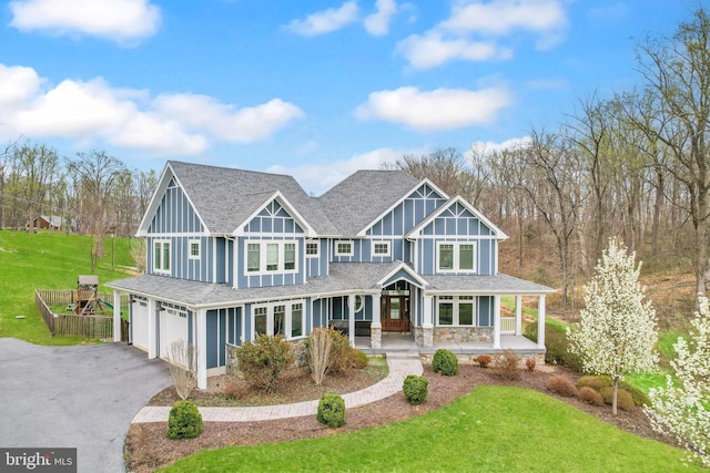 59 N Ridgemont Way, Shepherdstown, WV 25443 - view of front of property with a porch, a garage, a front yard, asphalt driveway, and a shingled roof