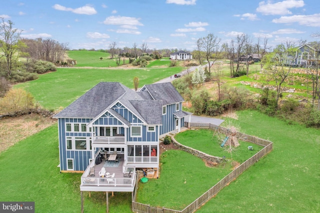 59 N Ridgemont Way, Shepherdstown, WV 25443 - rear view of house with a shingled roof, a wooden deck, board and batten siding, and a balcony