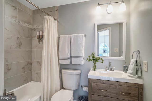 bathroom with vanity, toilet, and shower / bath combination with curtain