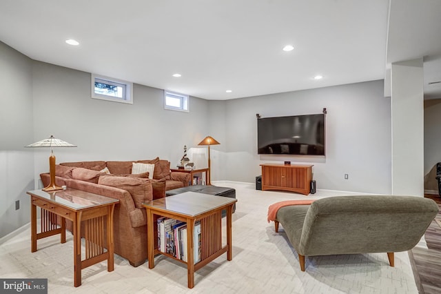 living area featuring recessed lighting and baseboards