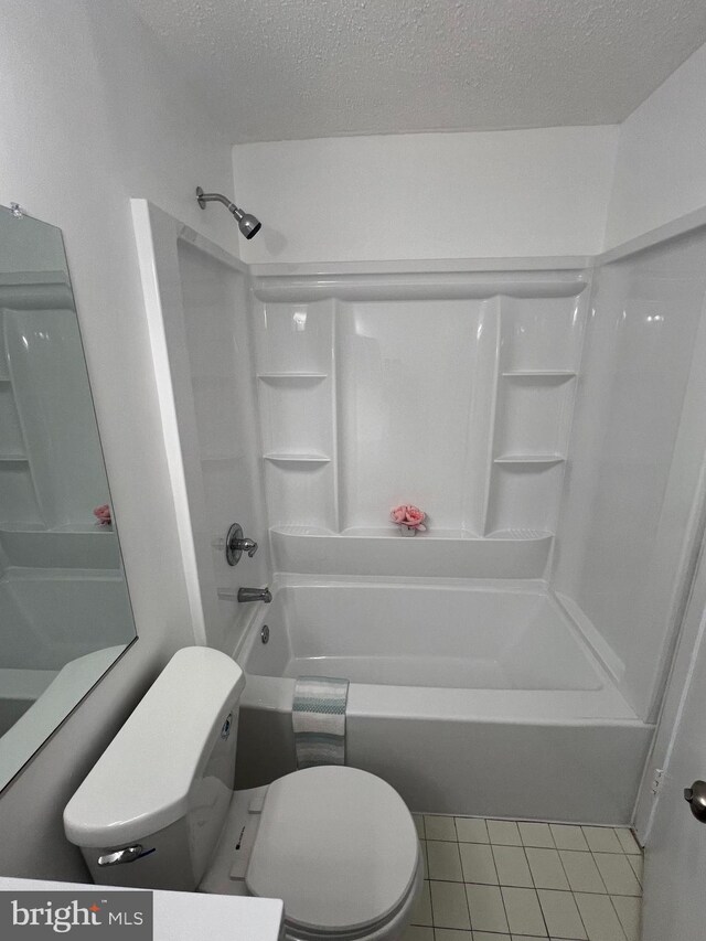 2357 Nutmeg Ter, Baltimore, MD 21209 - full bath with toilet, shower / bathtub combination, tile patterned floors, and a textured ceiling