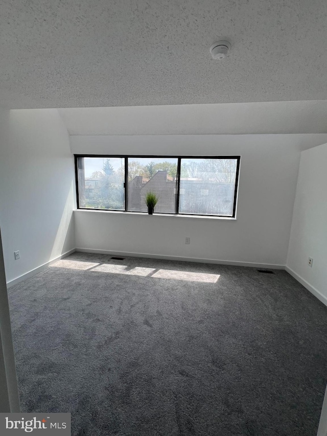 2357 Nutmeg Ter, Baltimore, MD 21209 - carpeted empty room featuring a textured ceiling, baseboards, and visible vents