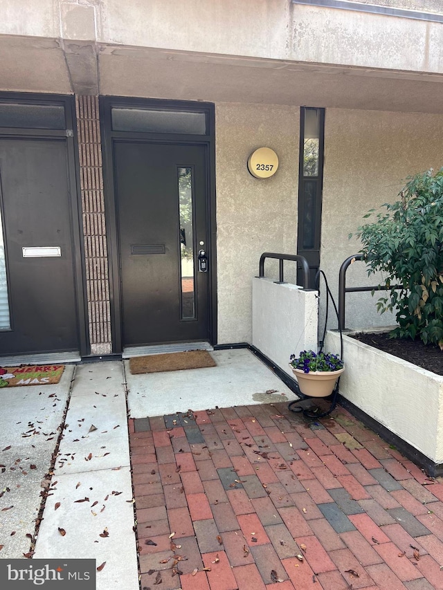 2357 Nutmeg Ter, Baltimore, MD 21209 - doorway to property featuring stucco siding