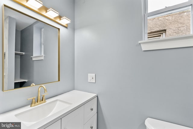 half bath with toilet and vanity