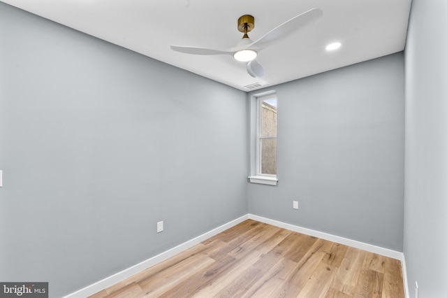 empty room with a ceiling fan, baseboards, light wood-style floors, and visible vents