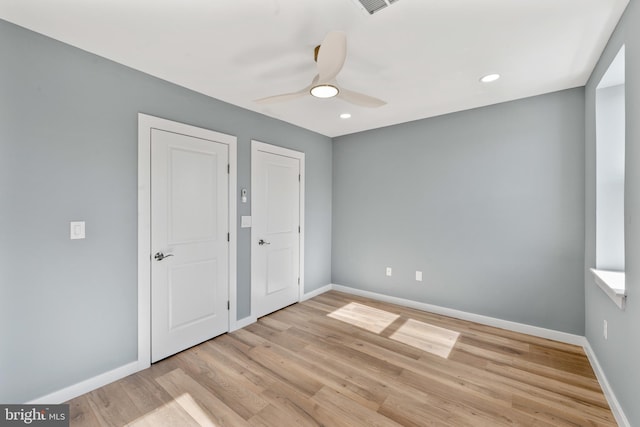 unfurnished bedroom with baseboards, light wood-style flooring, ceiling fan, and recessed lighting