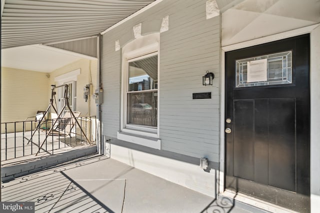 entrance to property with a porch