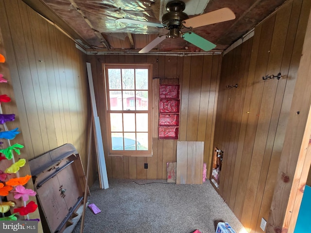 14248 Cunningham Dr SW, Cumberland, MD 21502 - interior space featuring wood walls, ceiling fan, and carpet