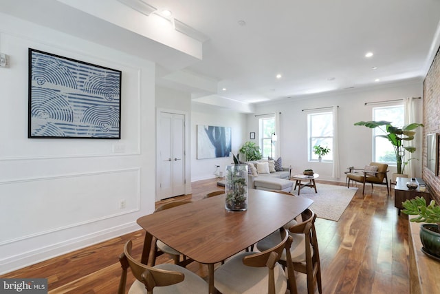 dining area with recessed lighting, baseboards, ornamental molding, and wood finished floors