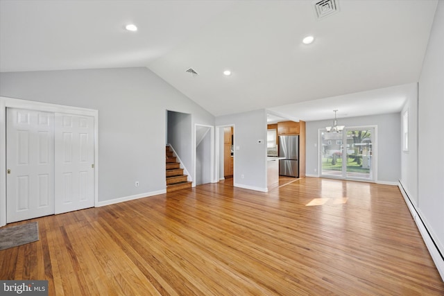 unfurnished living room with visible vents, vaulted ceiling, light wood-type flooring, a baseboard radiator, and a notable chandelier