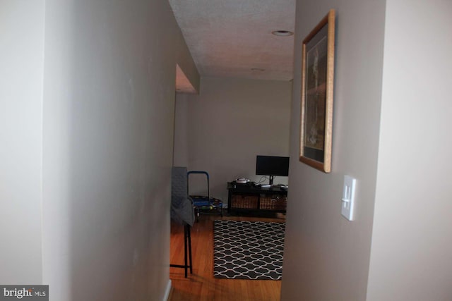 hall with wood finished floors