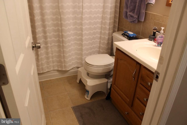 full bathroom featuring tile patterned floors, toilet, and vanity