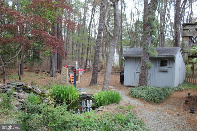 view of yard with a shed and an outdoor structure