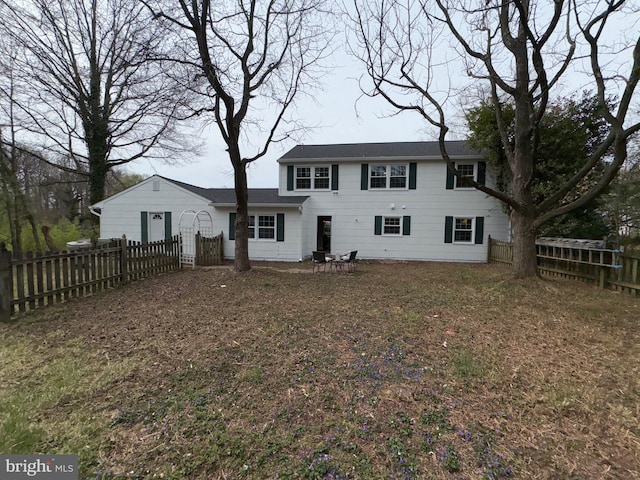 view of front of home featuring a fenced backyard
