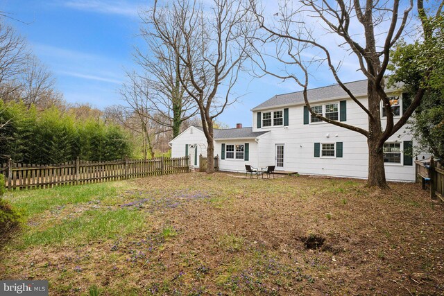 back of house with fence private yard