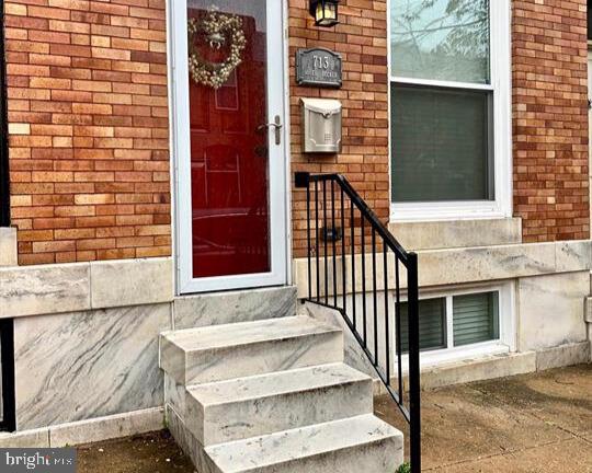 713 S Decker Ave, Baltimore, MD 21224 - view of exterior entry featuring brick siding