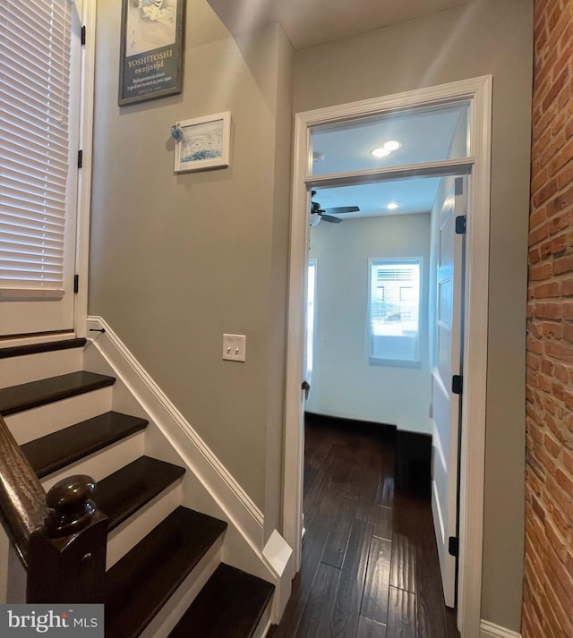 713 S Decker Ave, Baltimore, MD 21224 - stairs featuring hardwood / wood-style flooring, brick wall, and ceiling fan