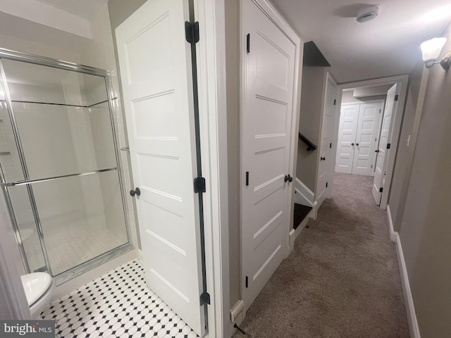 713 S Decker Ave, Baltimore, MD 21224 - bathroom featuring a stall shower, toilet, and baseboards