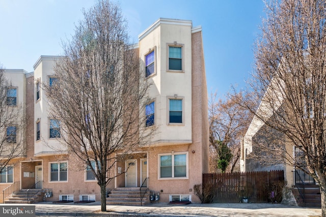 2306 N 12th St, Philadelphia, PA 19133 - view of property with stucco siding and fence