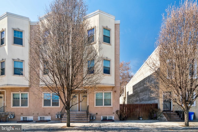 2306 N 12th St, Philadelphia, PA 19133 - exterior space with stucco siding and fence