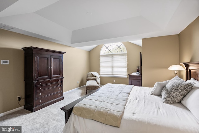 bedroom with visible vents, baseboards, vaulted ceiling, and carpet