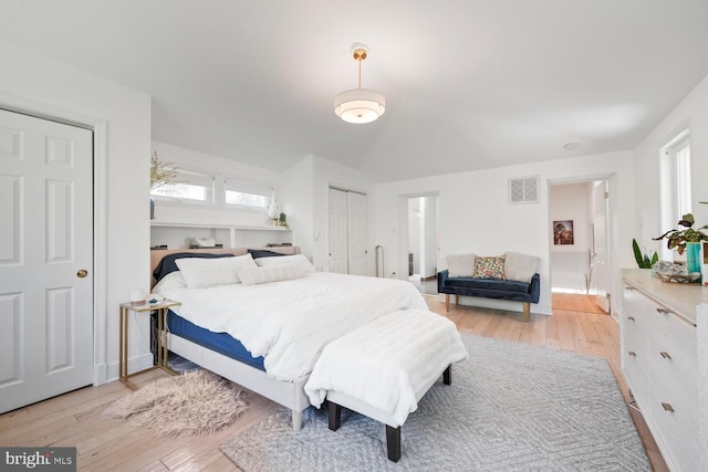 bedroom with visible vents and light wood finished floors