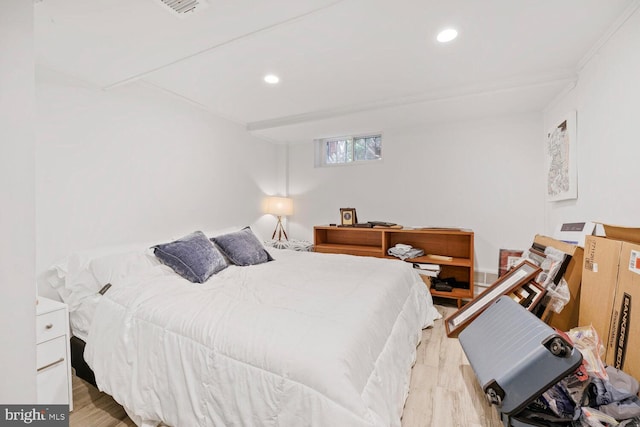 bedroom featuring recessed lighting, visible vents, and wood finished floors