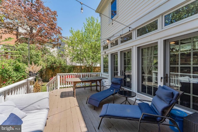 wooden deck featuring fence