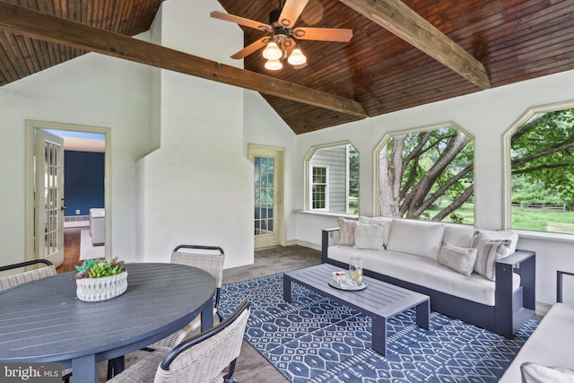 living area with wood ceiling and a ceiling fan